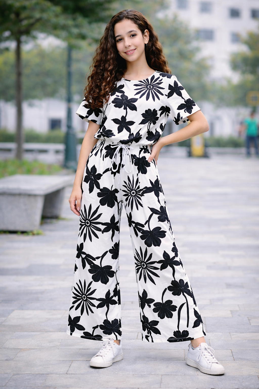 Teen girls white cotton co-ord set with black floral print, short sleeve top and wide-leg trousers, Pakistan
