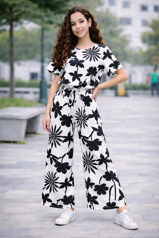 Teen girls white cotton co-ord set with black floral print, short sleeve top and wide-leg trousers, Pakistan
