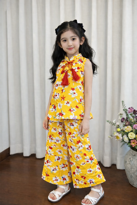 Yellow floral printed cotton girls co-ord set with sleeveless tassel top and wide-leg pants, kids outfit Pakistan.