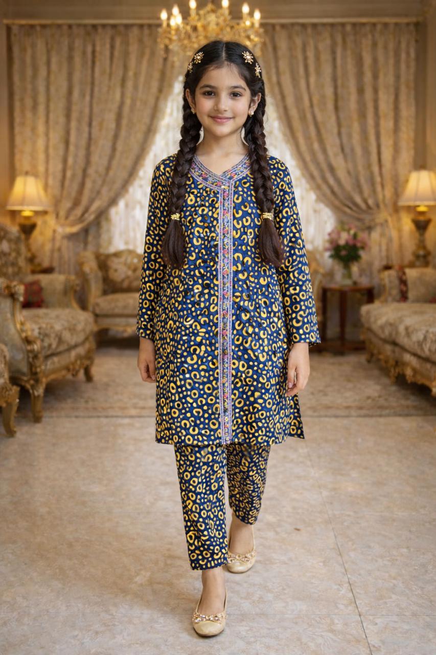 Blue printed cotton 2-piece outfit for girls with long kurti and straight pants, traditional indoor setting Pakistan
