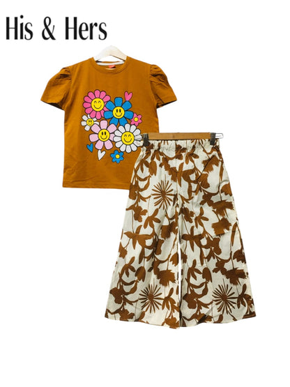 Brown cotton girls co-ord set with smiley flower print T-shirt and beige floral wide-leg pants, Pakistan
