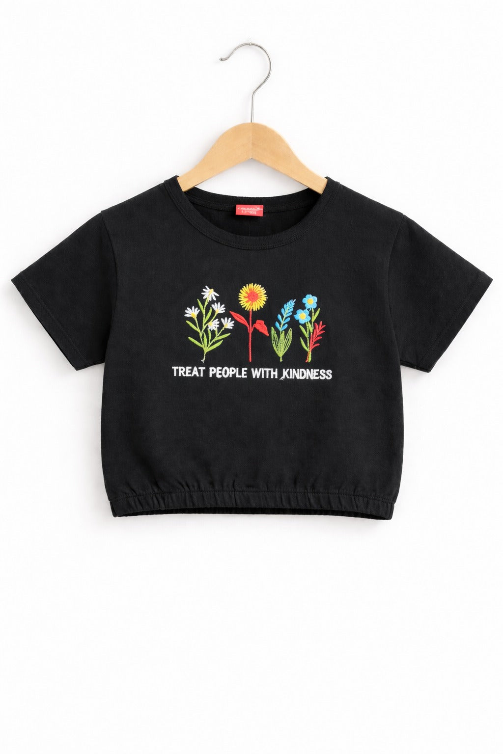 Girls black cotton crop t-shirt with colorful floral embroidery and “Treat People With Kindness” text, Pakistan casual summer Kidswear 
