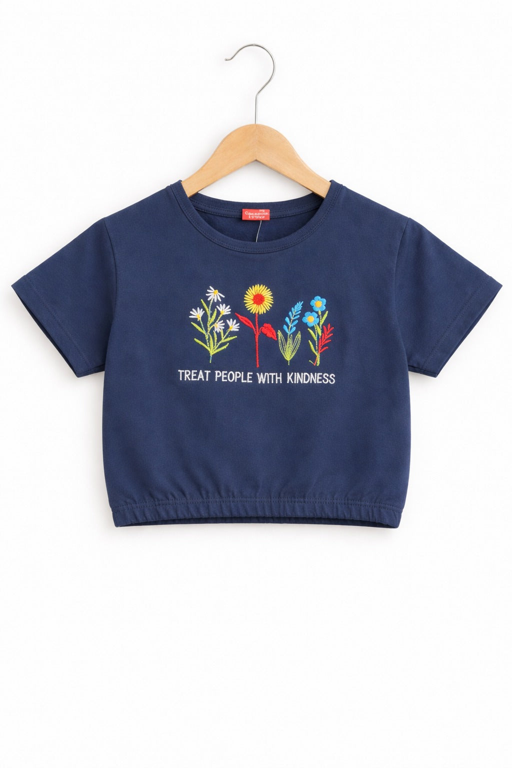Girls navy blue cotton crop t-shirt with colorful floral embroidery and “Treat People With Kindness” text, Pakistan casual summer Kidswear