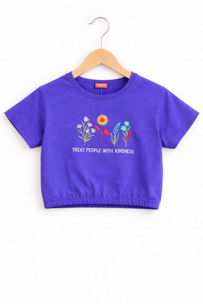 Girls purple cotton crop t-shirt with colorful floral embroidery and “Treat People With Kindness” text, Pakistan casual summer Kidswear

