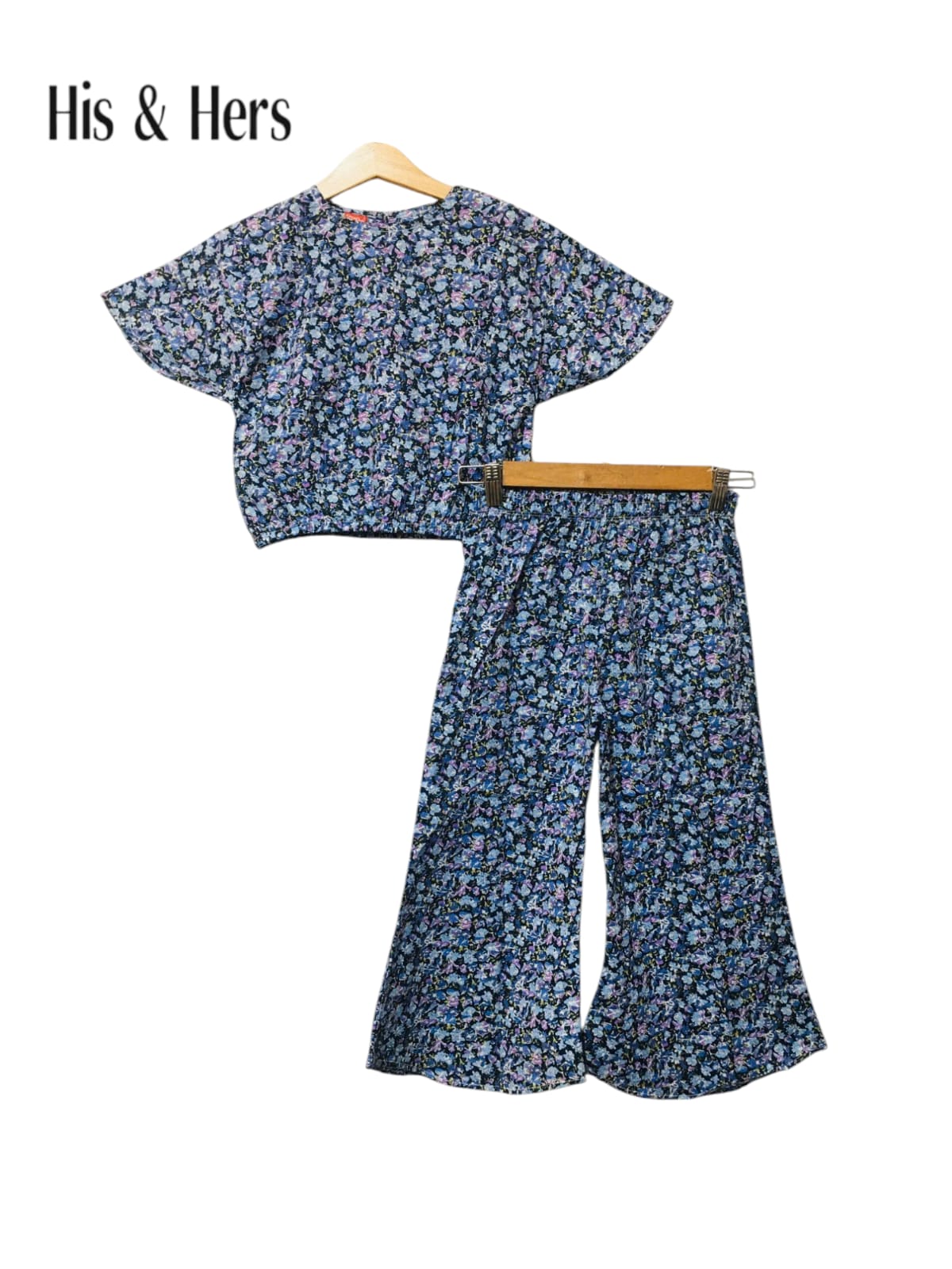 Navy blue cotton girls co-ord set with all-over floral print, short sleeve top and flared pants, Pakistan
