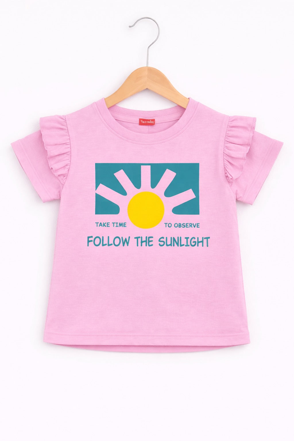 Girls light pink cotton t-shirt with sunshine graphic and “Follow The Sunlight” text print, frill sleeve casual summer Kidswear 
