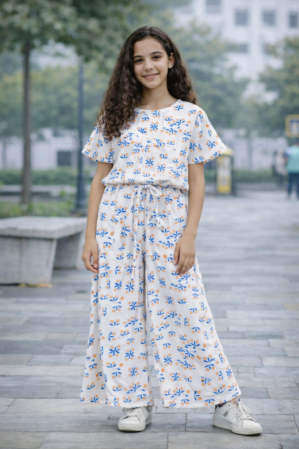 White cotton girls co-ord set with blue and orange floral print, short sleeve top and wide-leg pants,  Pakistan
