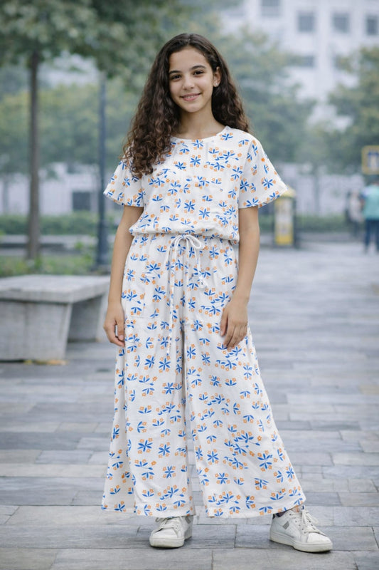 White cotton girls co-ord set with blue and orange floral print, short sleeve top and wide-leg pants,  Pakistan
