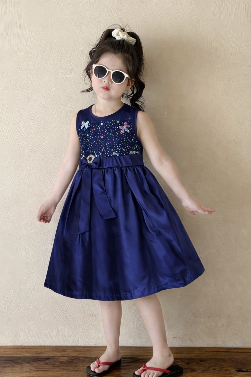 Girls navy blue sleeveless party dress with embellished bodice and bow detail, stylish kids fashion  Pakistan outfit 
