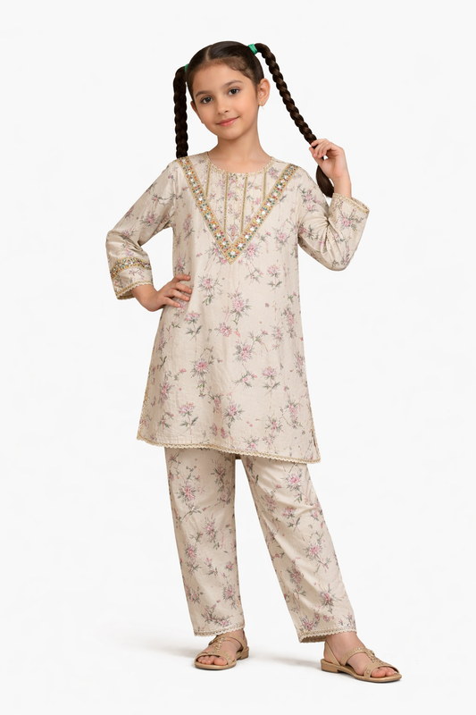 Beige floral printed cotton 2-piece outfit for girls with embroidered neckline kurti and straight pants, studio background Pakistan
