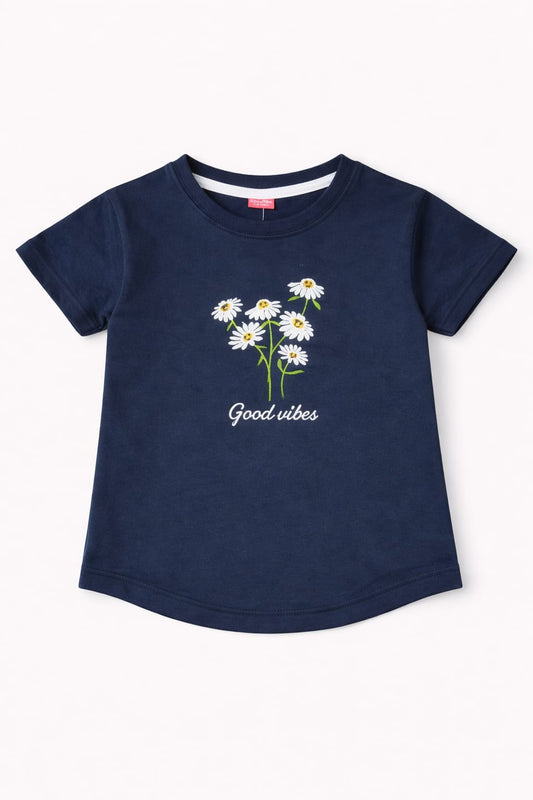 Navy blue girls t-shirt with daisy flower print and “Good vibes” text design in Pakistan.
