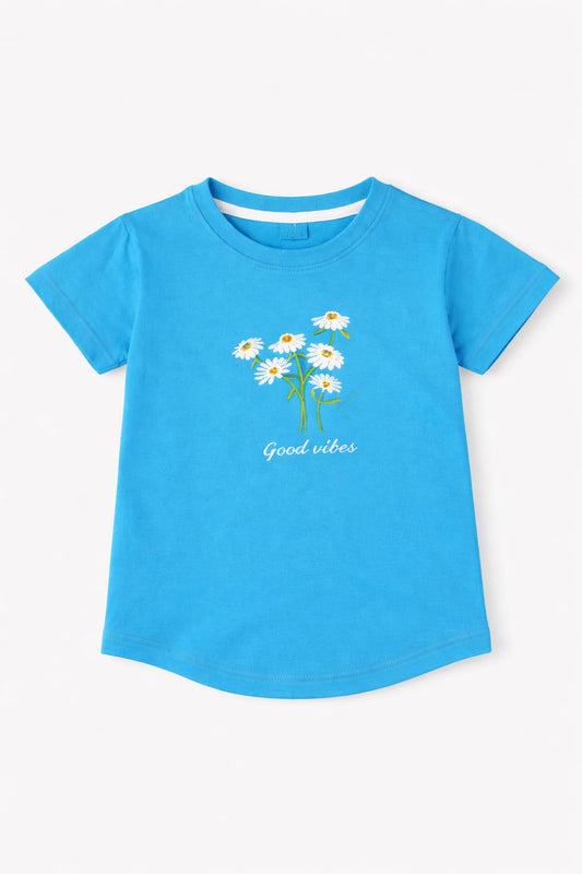 blue girls t-shirt with daisy flower print and “Good vibes” text design in Pakistan.