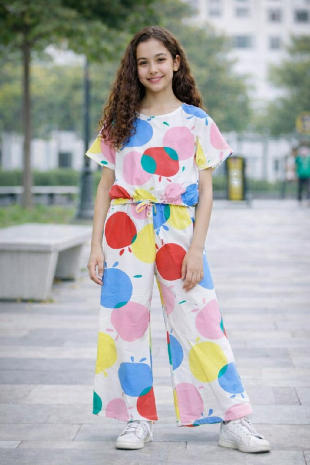White girls co-ord set with colorful apple print short sleeve top and matching wide-leg pants,  Pakistan
