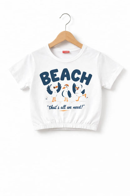 White girls crop t-shirt with “Beach That’s All We Need” bird graphic print and elastic hem design in Pakistan.
