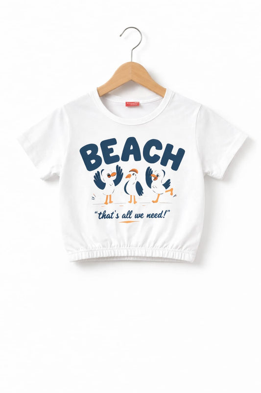 White girls crop t-shirt with “Beach That’s All We Need” bird graphic print and elastic hem design in Pakistan.
