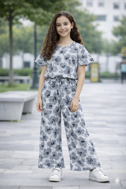 Grey floral printed cotton girls co-ord set with short sleeve top and wide-leg pants, casual outdoor street style Pakistan
