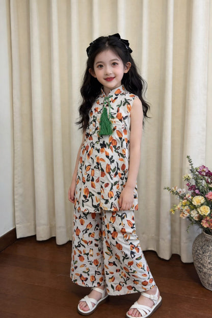 White cotton girls co-ord set with orange floral print, sleeveless top with green tassel detail and wide-leg pants,Pakistan kids Outfit