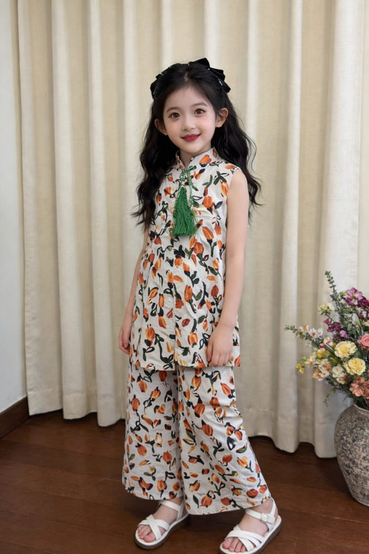 White cotton girls co-ord set with orange floral print, sleeveless top with green tassel detail and wide-leg pants,Pakistan kids Outfit