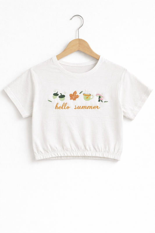 White girls crop t-shirt with “Hello Summer” graphic print and elastic hem design in Pakistan.
