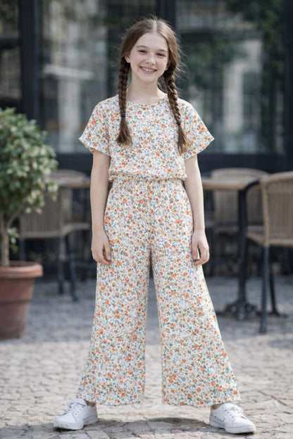 Girls cream floral printed  Co-Ord_Set with orange flower pattern and wide-leg pants, casual cotton summer outfit with white sneakers.
