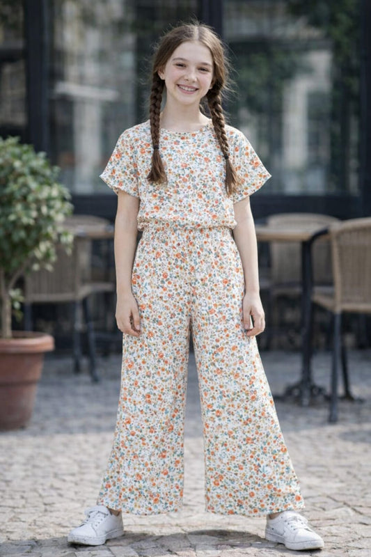 Girls cream floral printed  Co-Ord_Set with orange flower pattern and wide-leg pants, casual cotton summer outfit with white sneakers.
