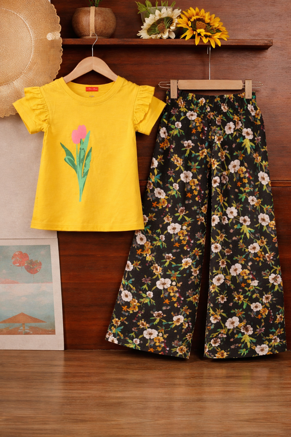Yellow cotton girls co-ord set with flower print ruffle sleeve T-shirt and black floral wide-leg pants,  Pakistan
