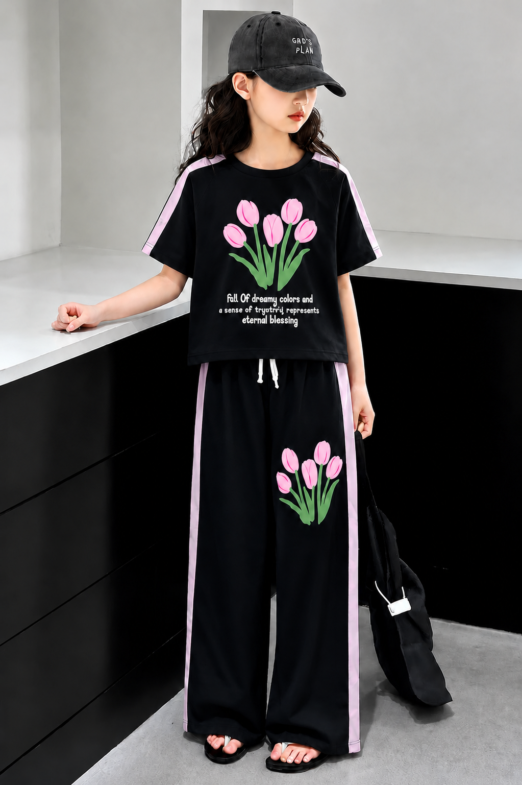 Stylish black girls co-ord set with soft jersey fabric and wide-leg trousers for trendy summer wear in Pakistan.