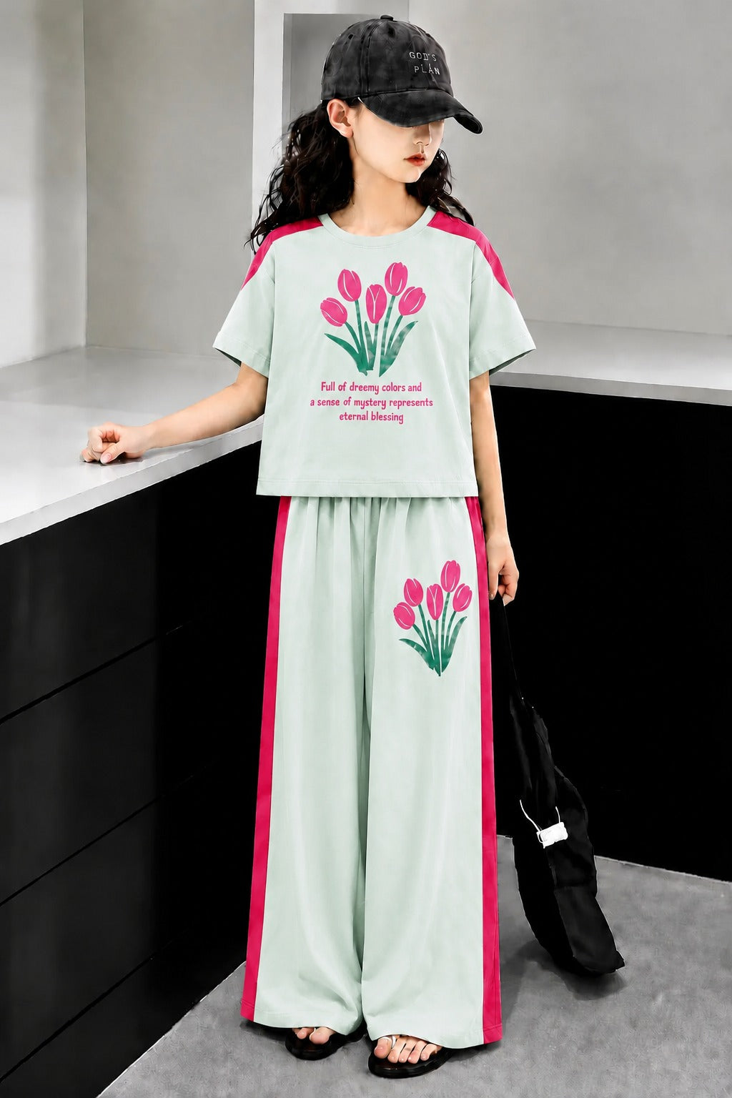Mint green girls’ floral print co-Ord set with pink contrast panels and matching wide-leg pants.
