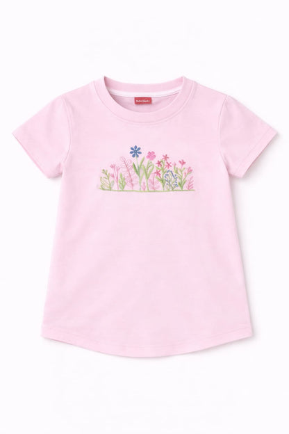 Light pink girls t-shirt with delicate floral embroidery, short sleeves and soft cotton fabric in Pakistan.
