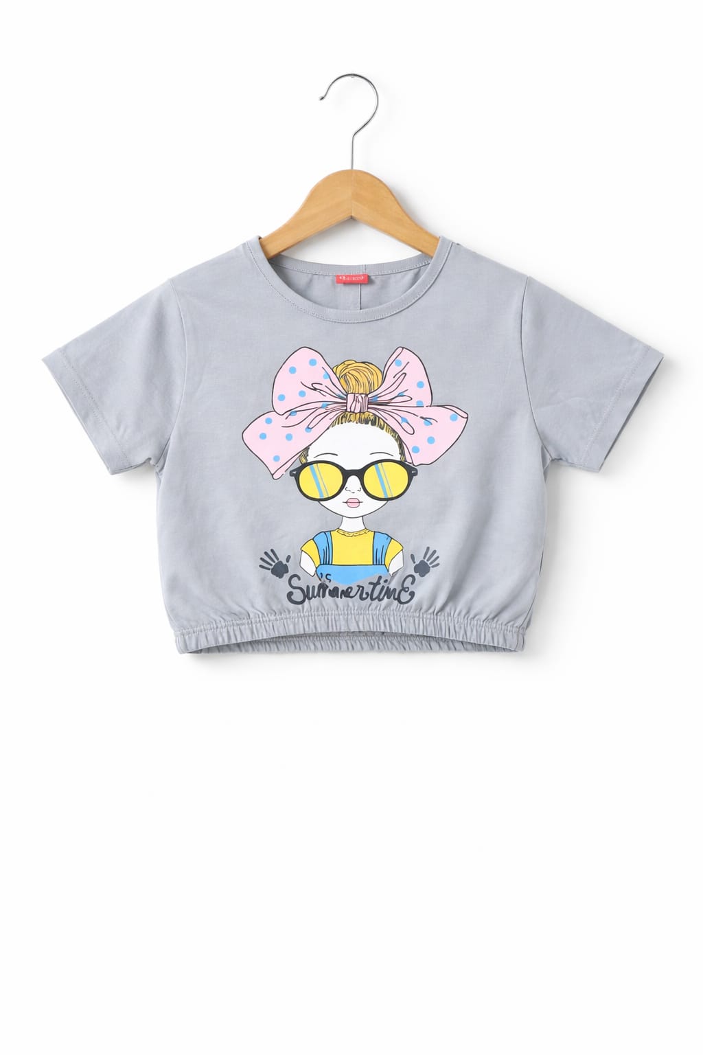 Light grey girls crop t-shirt with cute girl graphic, bow and sunglasses print, elastic hem and soft cotton fabric in Pakistan.
