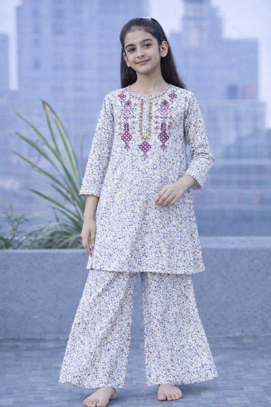 White floral printed cotton 2-piece outfit for girls with embroidered neckline kurti and flared pants, balcony setting Pakistan
