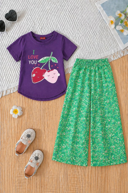 Girls purple cherry print t-shirt with green floral wide leg trousers co-ord set, soft cotton summer outfit for kids in Pakistan.
