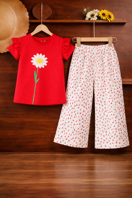 Red daisy print cotton t-shirt with white printed pants kids outfit on wooden hanger.