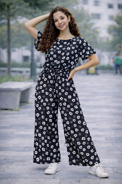 Girls black cotton floral co-ord set with white print, Pakistani outfit outdoor setting