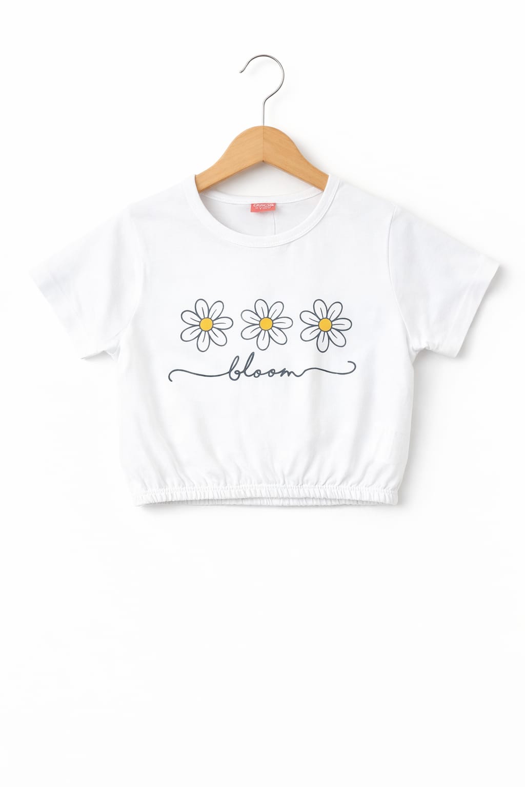White girls crop t-shirt with daisy flower “Bloom” print, elastic hem and soft cotton fabric in Pakistan.
