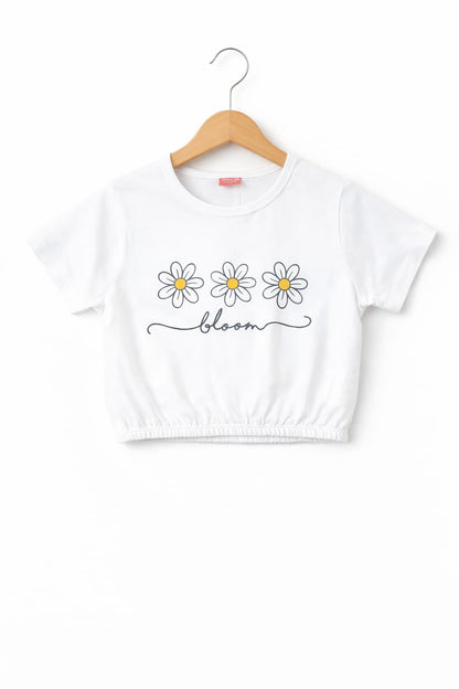 White girls crop t-shirt with daisy flower “Bloom” print, elastic hem and soft cotton fabric in Pakistan.
