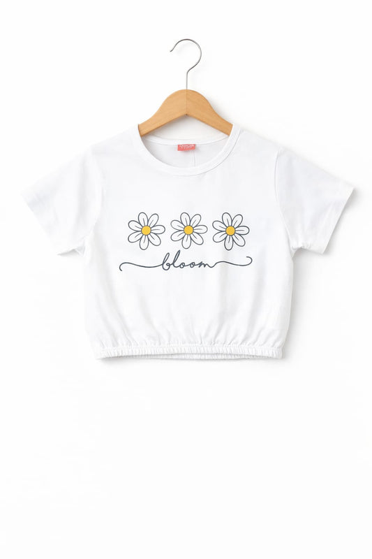 White girls crop t-shirt with daisy flower “Bloom” print, elastic hem and soft cotton fabric in Pakistan.
