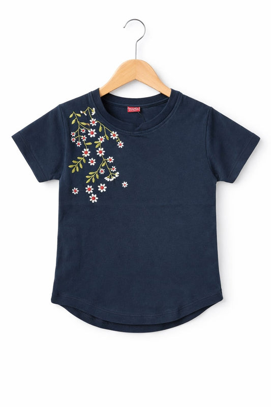 Navy blue girls t-shirt with floral shoulder embroidery, short sleeves and soft cotton fabric in Pakistan.
