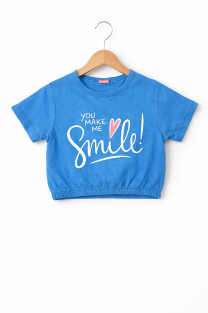 Blue girls slogan print crop t-shirt with “You Make Me Smile” text design in Pakistan.
