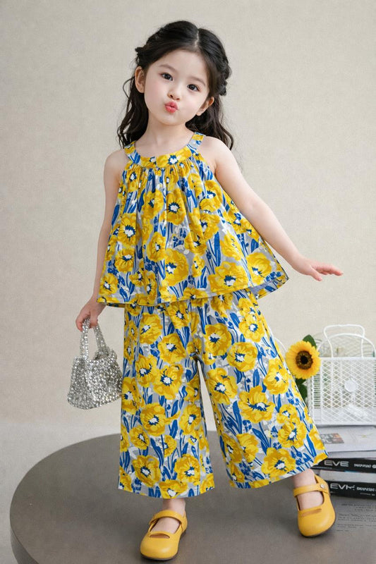 Yellow floral cotton girls co-ord set with sleeveless ruffle top and wide-leg pants, casual studio style Pakistan
