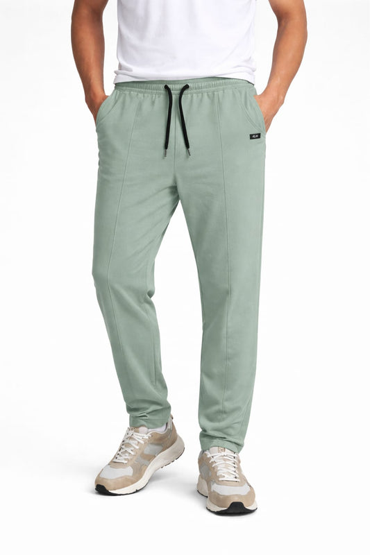 Men’s premium sage green jogger trousers with elastic waistband and black adjustable drawstring.