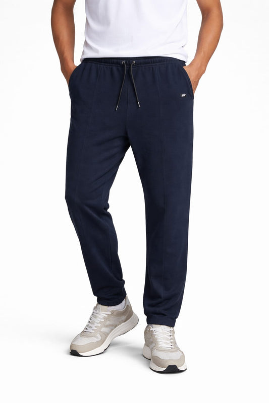Men’s premium navy blue cotton jogger trousers with elastic waist, adjustable drawstring and side pockets. 
